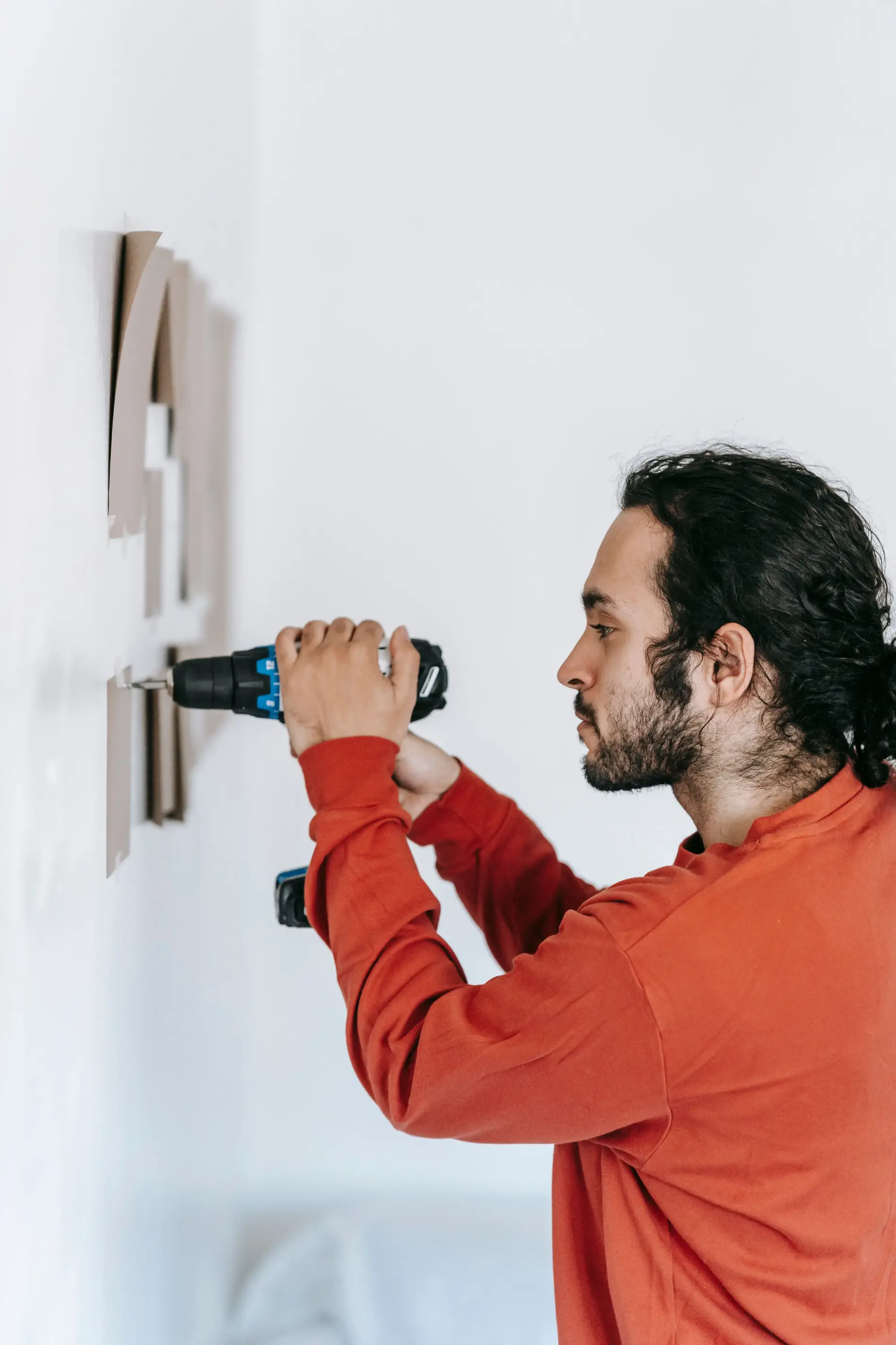 Handyman installing a wall bracket